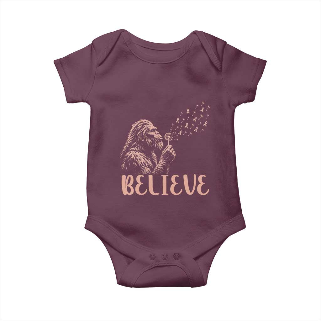 Funny Bigfoot Blowing Dandelion Flower Graphic Baby Onesie Believe Endometrial Cancer Awareness