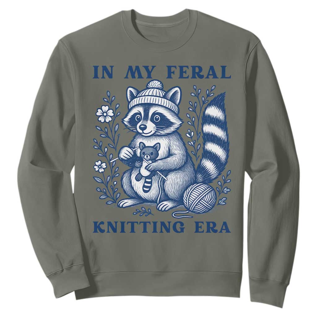 In My Feral Knitting Era Sweatshirt Raccoon Yarn Lover TS12 Military Green Print Your Wear