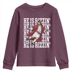 He Is Rizzin Youth Sweatshirt Funny Christian Soccer Lover Gift TS12 Maroon Print Your Wear