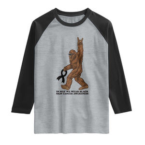 Funny Bigfoot Skin Cancer Support Raglan Shirt In May We Wear Black TS12 Heather Gray Black Print Your Wear