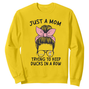 Just A Mom Trying To Keep Her Ducks In A Row Sweatshirt Funny Duck Mom Messy Hair Bun Moms Life TS14 Daisy Print Your Wear
