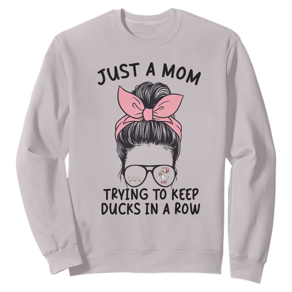Just A Mom Trying To Keep Her Ducks In A Row Sweatshirt Funny Duck Mom Messy Hair Bun Moms Life TS14 Ice Gray Print Your Wear