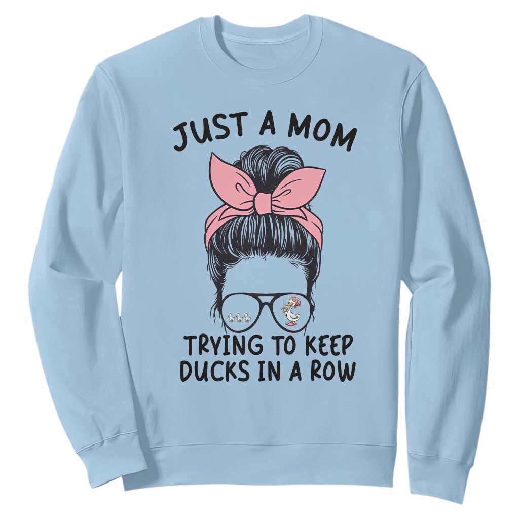 Just A Mom Trying To Keep Her Ducks In A Row Sweatshirt Funny Duck Mom Messy Hair Bun Moms Life TS14 Light Blue Print Your Wear
