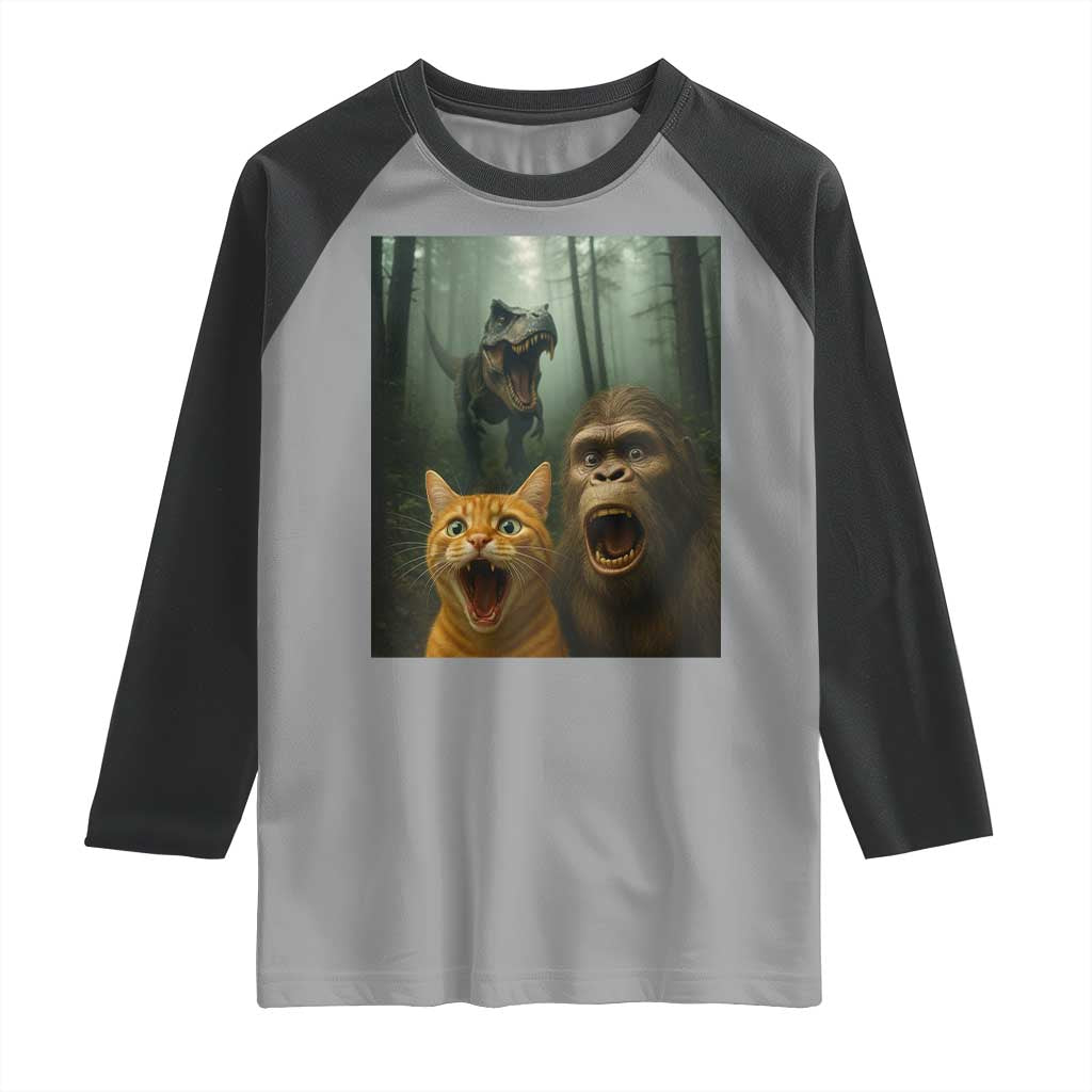 Cat Bigfoot Selfie With Dinosaur Raglan Shirt Funny Surprised Scared Sasquatch Cat TS14 Sport Gray Black Print Your Wear