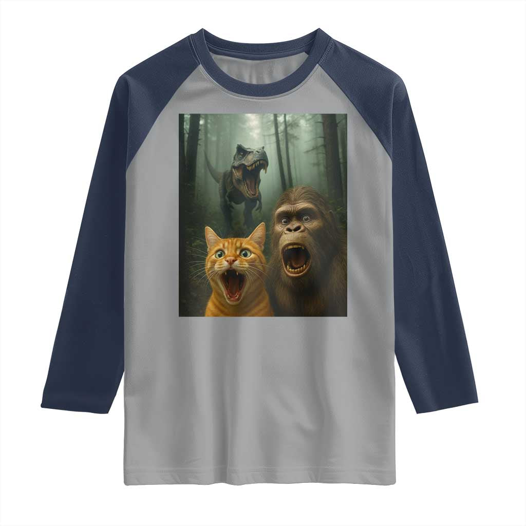 Cat Bigfoot Selfie With Dinosaur Raglan Shirt Funny Surprised Scared Sasquatch Cat TS14 Sport Gray Navy Print Your Wear