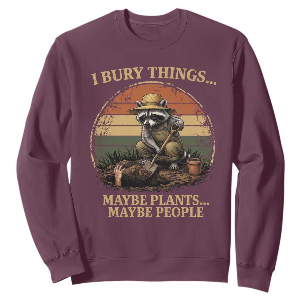 I Bury Things Maybe Plants Maybe People Sweatshirt Funny Gardening Raccoon Meme TS14 Maroon Print Your Wear