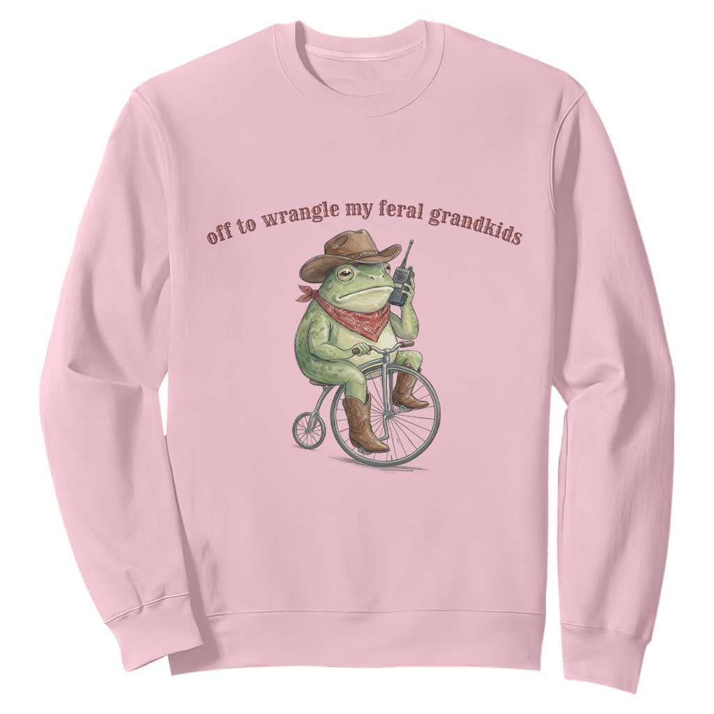 Off to Wrangle My Feral Grandkids Sweatshirt Funny Cowboy Frog Grandpa Western Meme TS14 Light Pink Print Your Wear