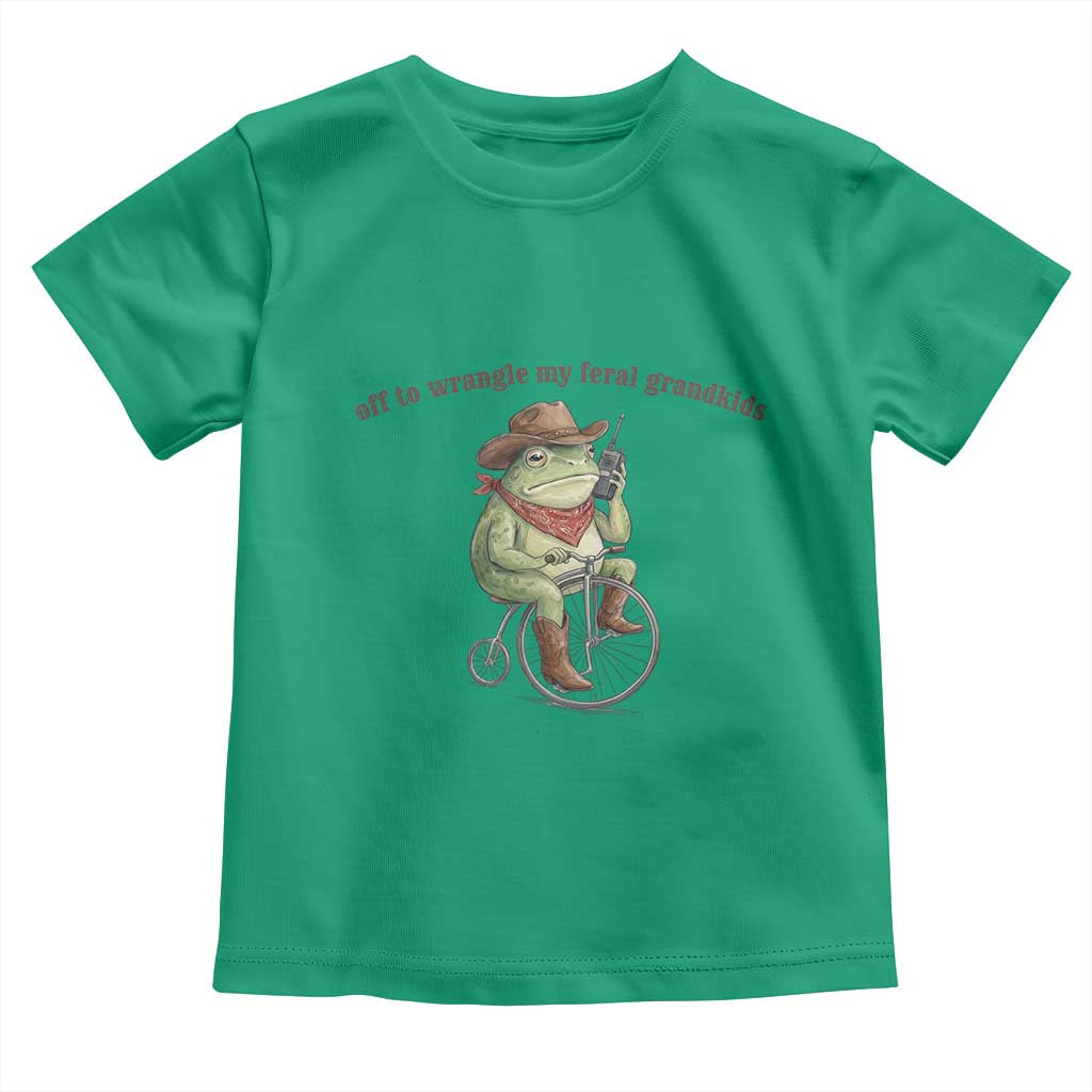 Off to Wrangle My Feral Grandkids Toddler T Shirt Funny Cowboy Frog Grandpa Western Meme TS14 Irish Green Print Your Wear