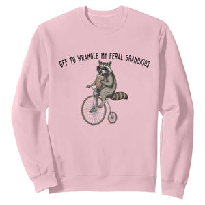 Off To Wranglin My Feral Grandkids Sweatshirt Funny Raccoon Grandpa Father's Day Gift TS14 Light Pink Print Your Wear