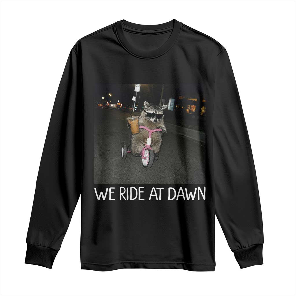 We Ride at Dawn Long Sleeve Shirt Funny Racoon Riding Tricycle Chaotic Meme TS14 Black Print Your Wear