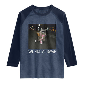 We Ride at Dawn Raglan Shirt Funny Racoon Riding Tricycle Chaotic Meme