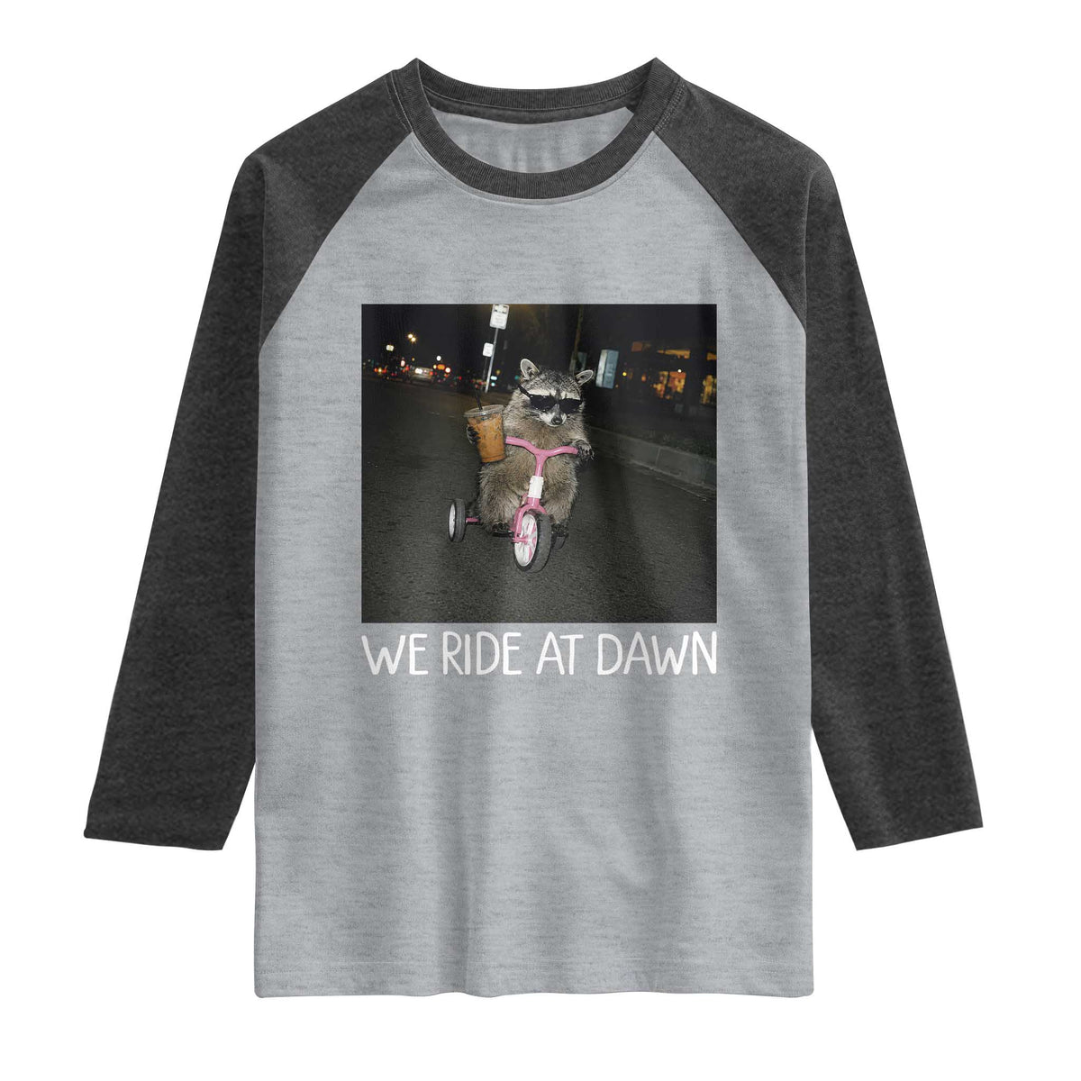We Ride at Dawn Raglan Shirt Funny Racoon Riding Tricycle Chaotic Meme