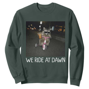 We Ride at Dawn Sweatshirt Funny Racoon Riding Tricycle Chaotic Meme