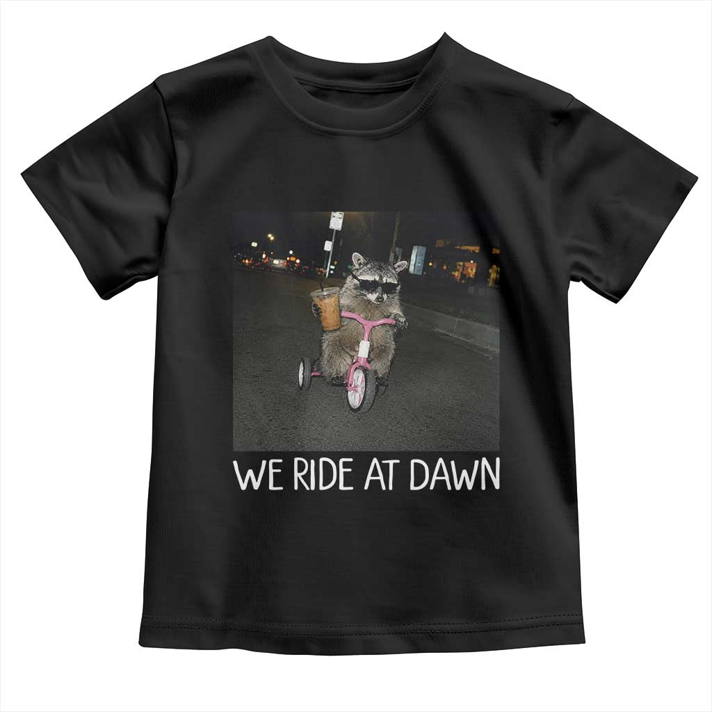 We Ride at Dawn Toddler T Shirt Funny Racoon Riding Tricycle Chaotic Meme TS14 Black Print Your Wear
