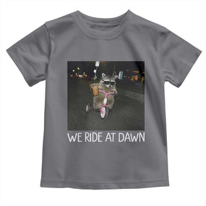We Ride at Dawn Toddler T Shirt Funny Racoon Riding Tricycle Chaotic Meme