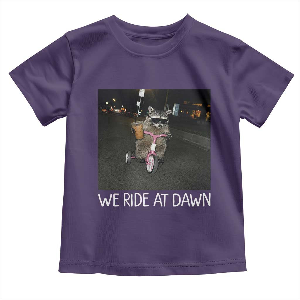 We Ride at Dawn Toddler T Shirt Funny Racoon Riding Tricycle Chaotic Meme