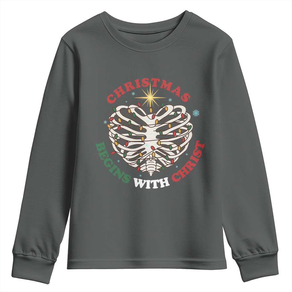 Funny Skeleton Christian Youth Sweatshirt Christmas Begins With Christ TS14 Dark Heather Print Your Wear