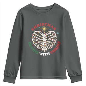Funny Skeleton Christian Youth Sweatshirt Christmas Begins With Christ TS14 Dark Heather Print Your Wear