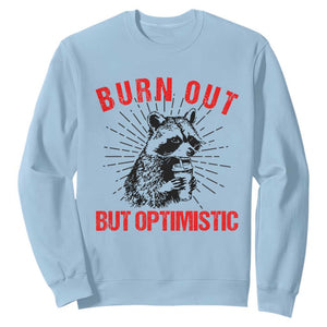 Burnt Out But Optimistic Sweatshirt Funny Raccoon Meme TS14 Light Blue Print Your Wear